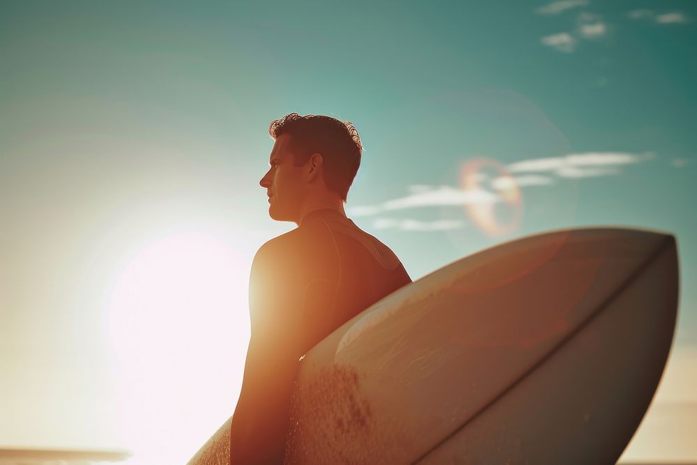Man holding surfboard outdoors surfing nature.