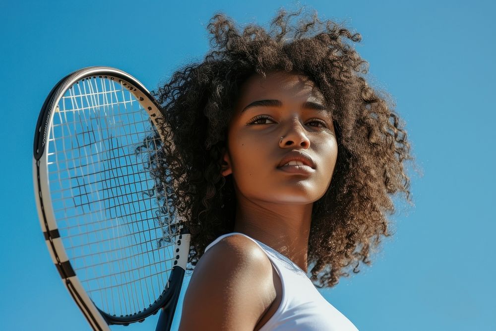 Black woman holding tennis racket outdoors sports adult.