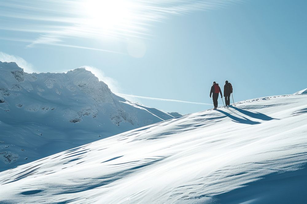 Couple walking hiking in the snow mountain outdoors recreation nature.