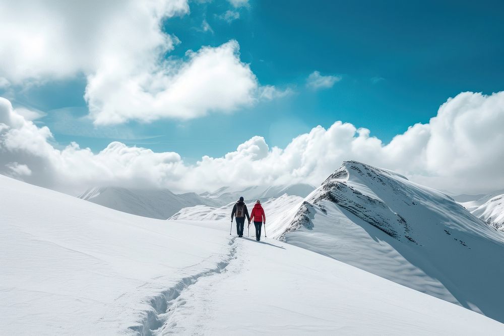 Couple walking hiking in the snow mountain outdoors recreation backpack.