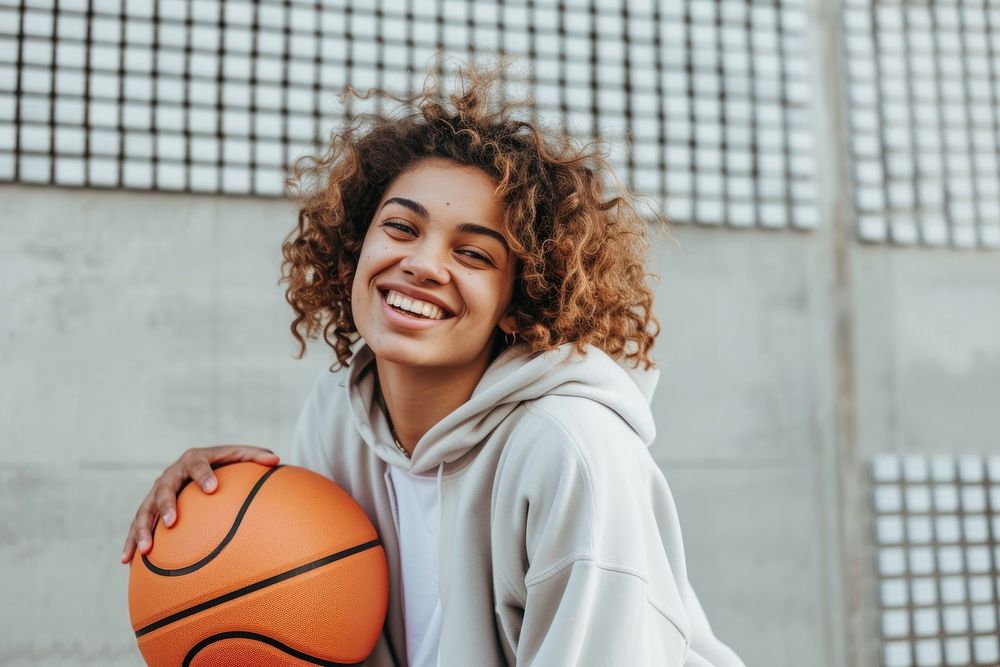 Mid adult woman playing basketball sports smile happy.