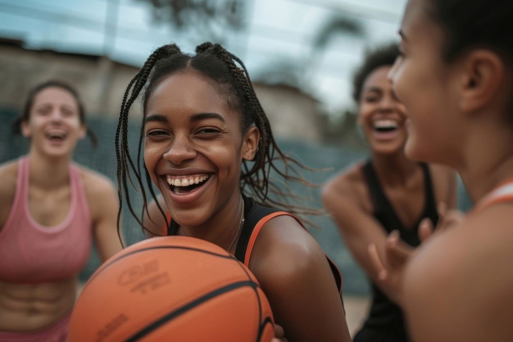 Mid adult woman playing basketball laughing sports smile.