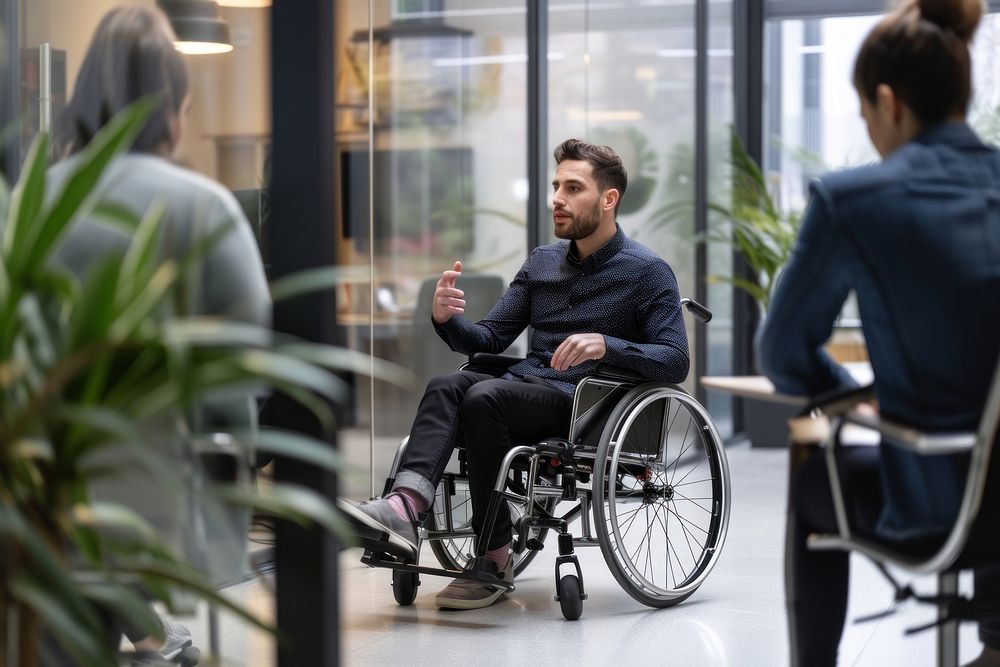 Man in wheelchair adult architecture conversation.