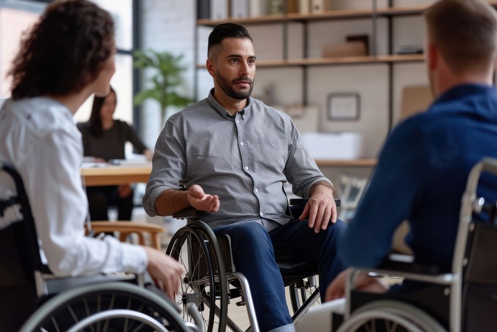 Man in wheelchair talking adult conversation.