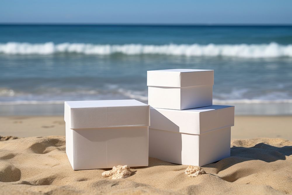 Three stacked boxes packaging beach sea cardboard.