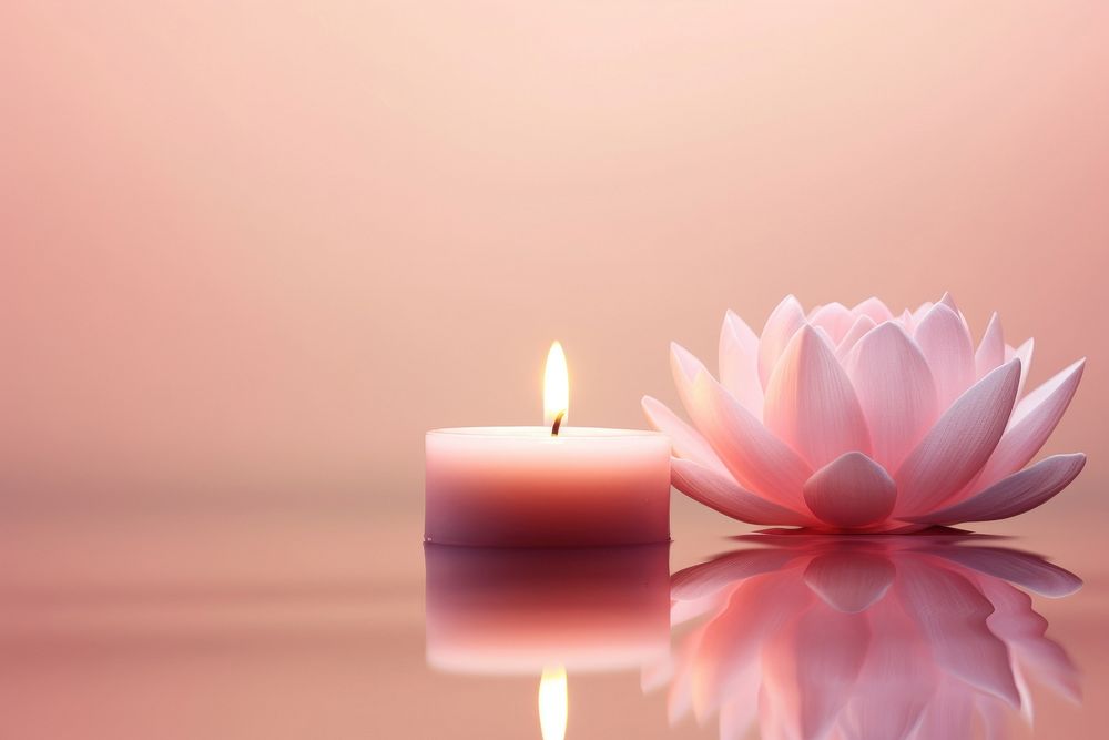 Candle and lotus on pink water pattern flower inflorescence spirituality.