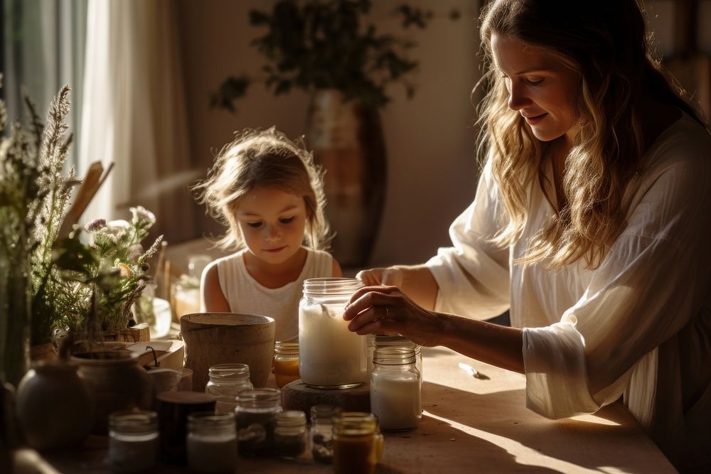 Photo of mother and child making organic candle adult togetherness toothbrush.
