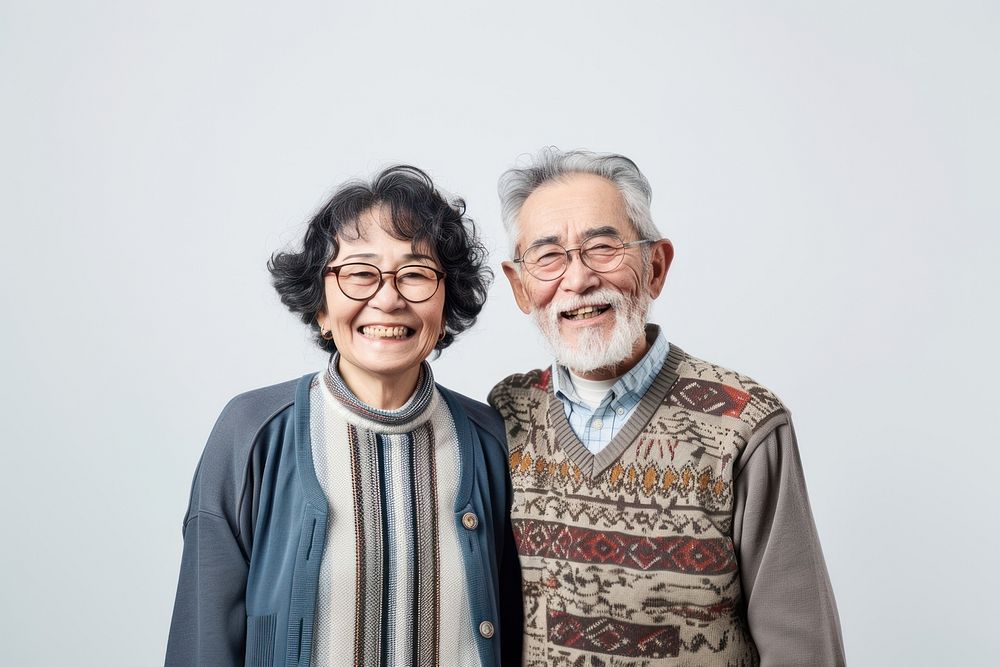 Senior couple laughing portrait glasses.