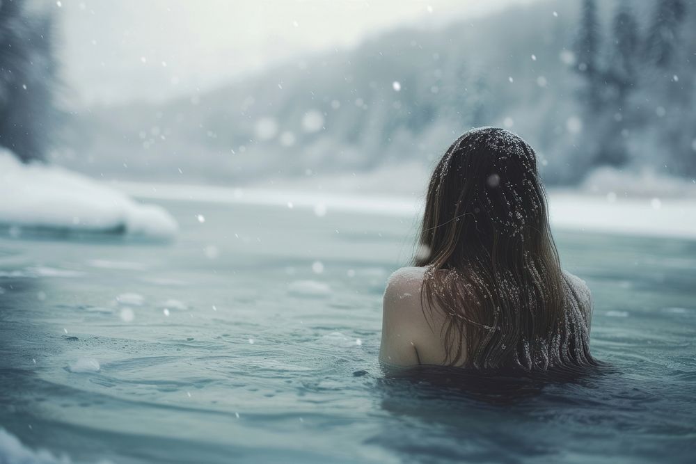Woman ice or winter Soak in water in a frozen lake swimming outdoors nature.