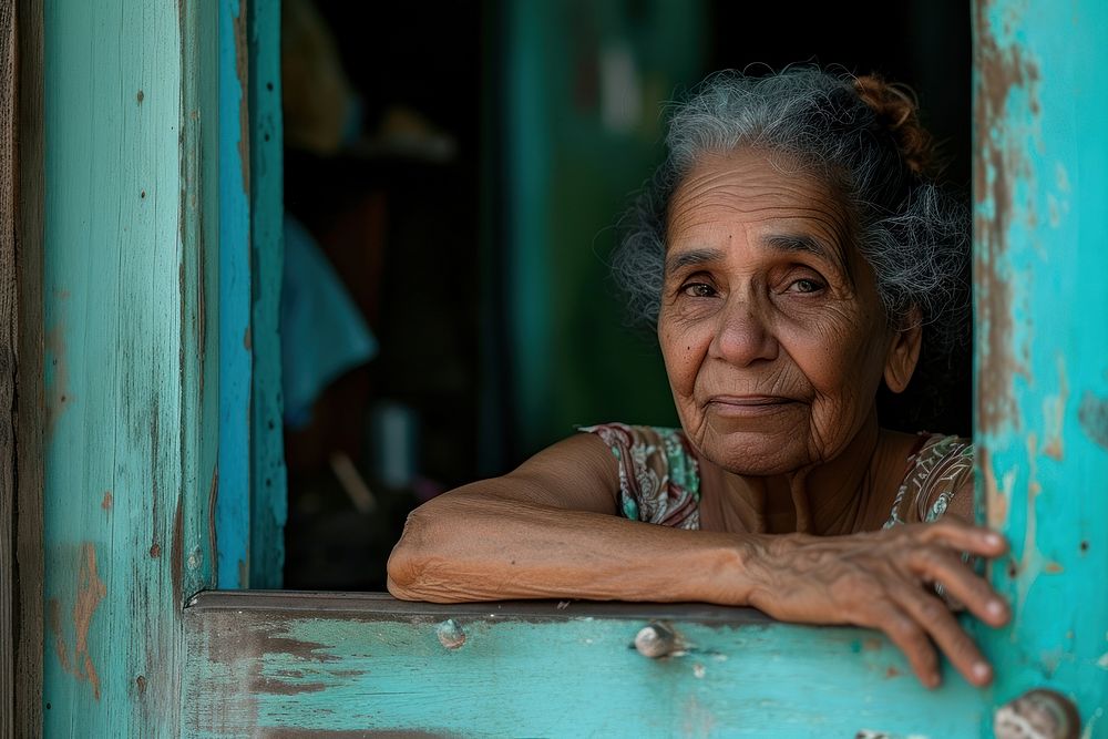 Cuban mature woman looking over the door adult architecture loneliness.