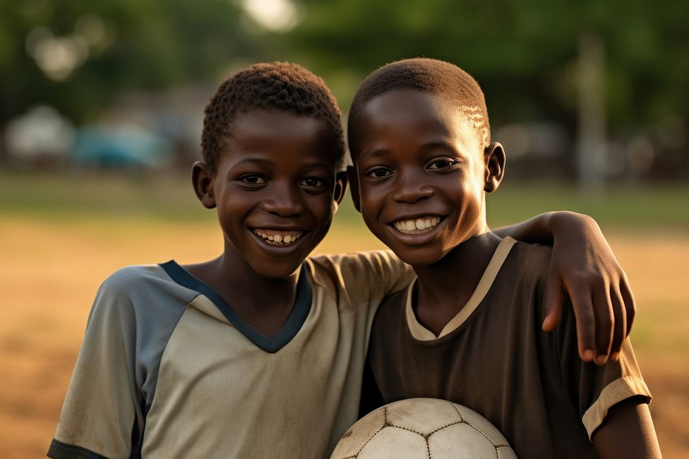 Boys play football sports child smile.