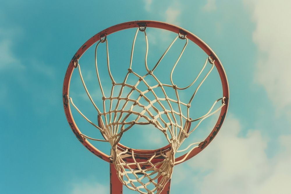 Basketball rim with basketball sports chandelier outdoors.