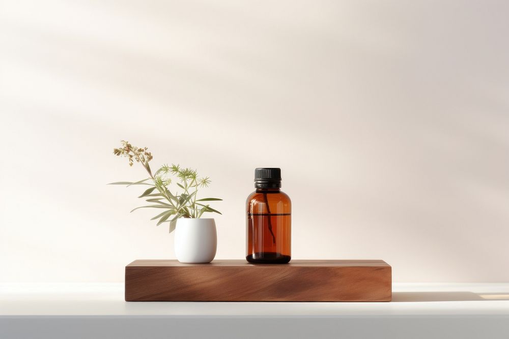 Essential oil with Podium Mockup bottle plant vase.