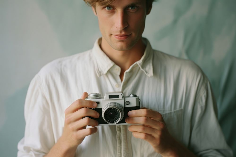 White shirt camera portrait photo.