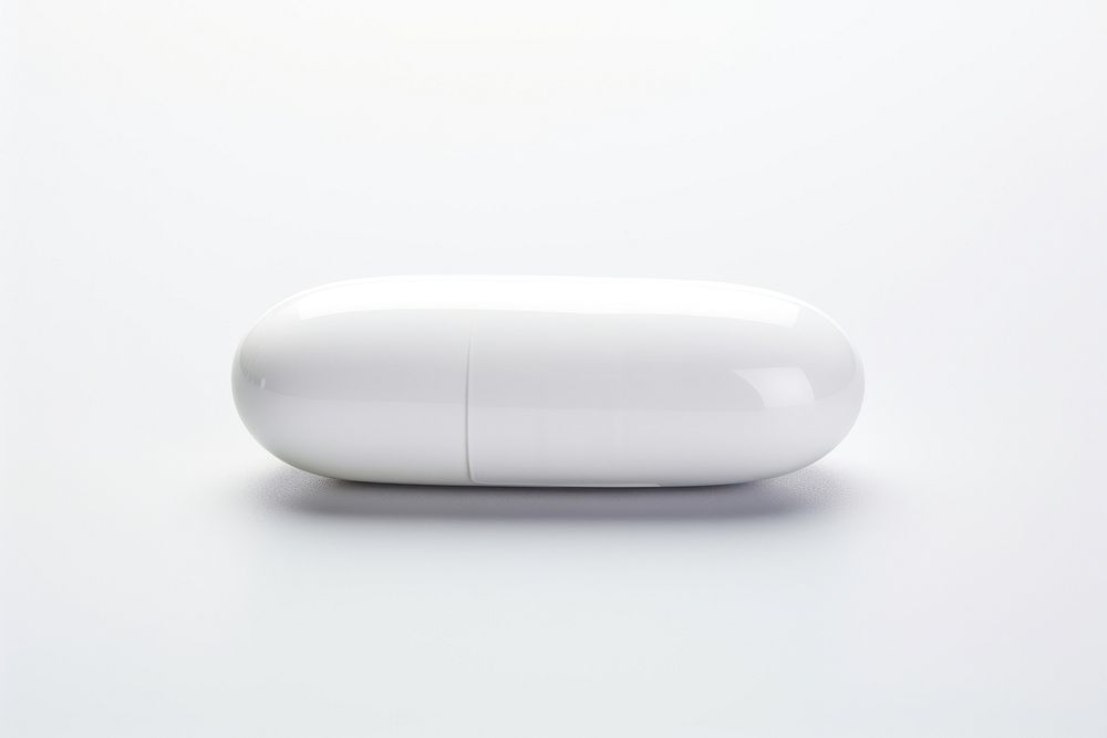 White pill capsule white white background.