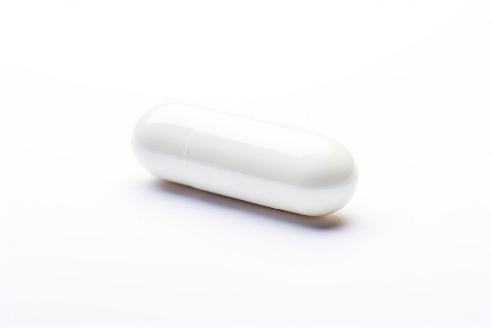 White pill capsule white white background.