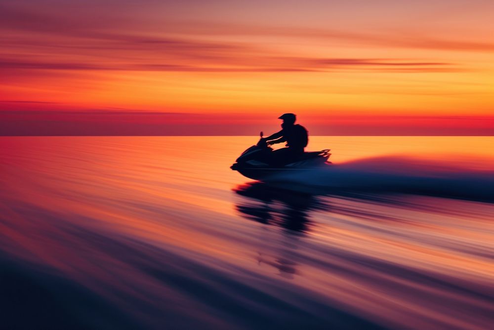 Attractive man riding a aquabike at sunset outdoors nature sports.