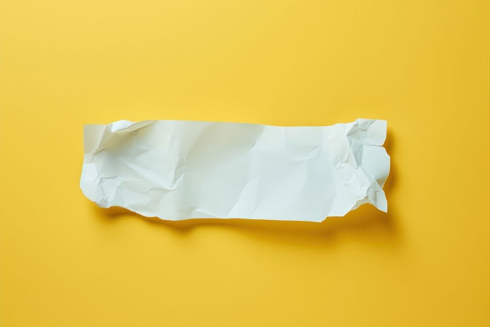 Piece of paper crumpled yellow diaper.