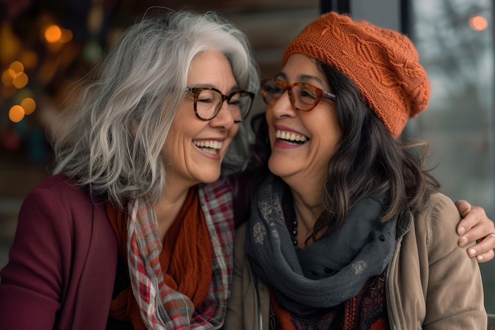 Joyful mature women lover laughing together glasses scarf smile.