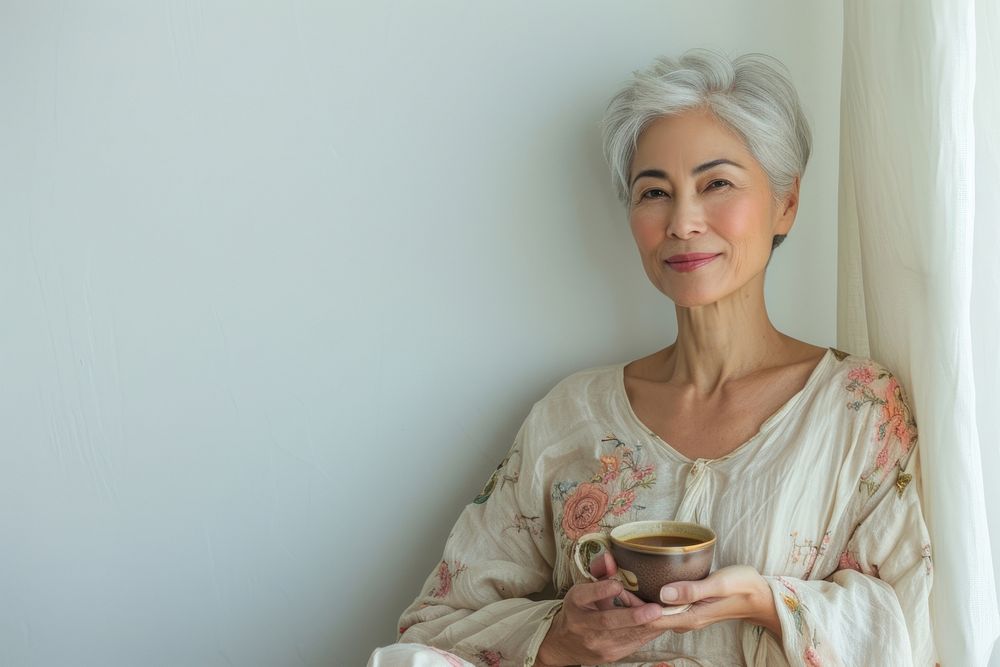 Mature woman in tea time refreshment relaxation retirement.