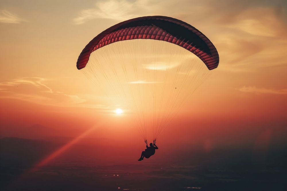 Paragliding recreation adventure dawn.