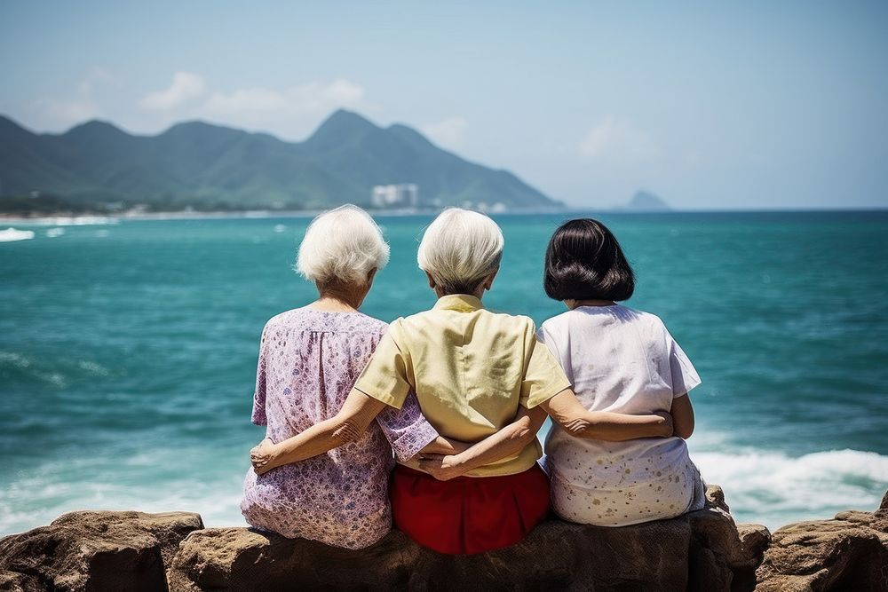 3 friends Chinese elderly sea outdoors vacation.