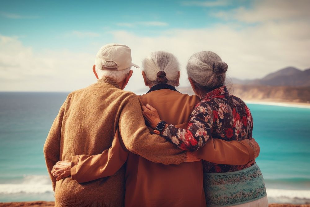 3 friends latino elderly sea outdoors vacation.