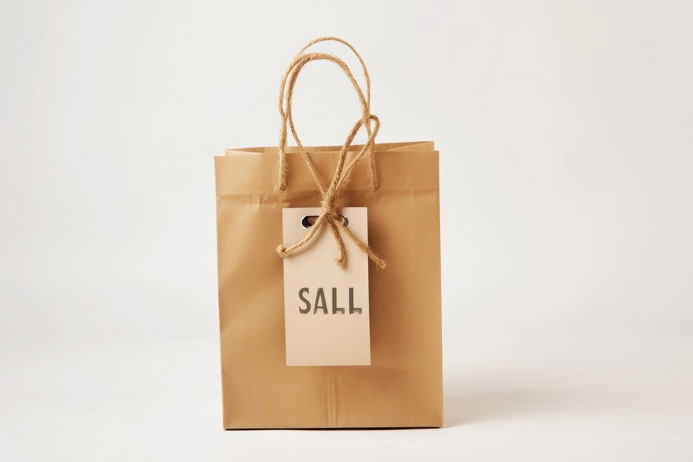 Shopping bag and gift with sale label handbag white background accessories.