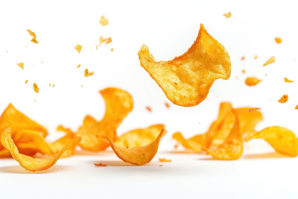 Photo of flying chips snack food white background.