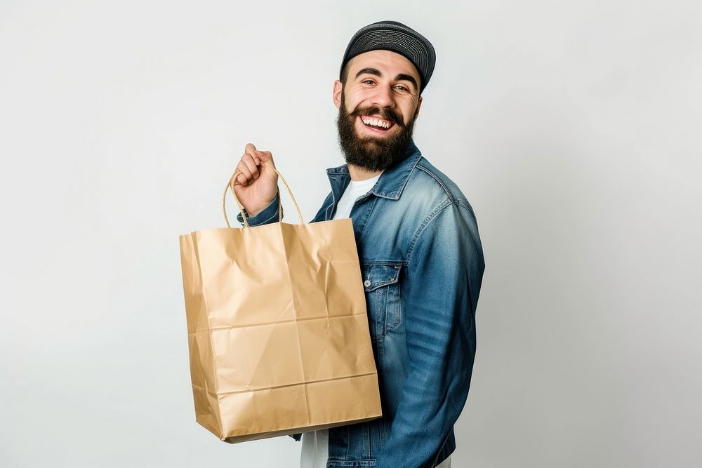 Happy men holding shopping bag adult white background accessories.