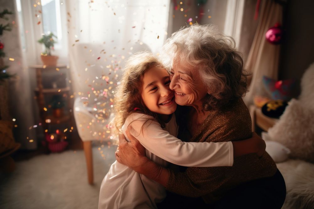 Latino little girl hug her grandmother portrait hugging adult.