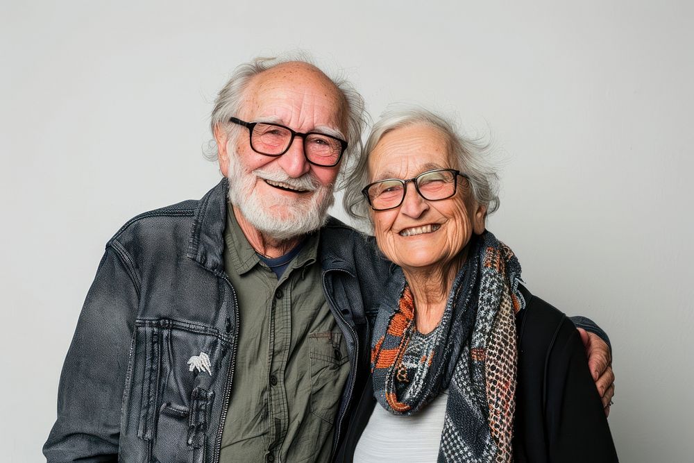 Senior couple laughing portrait glasses.