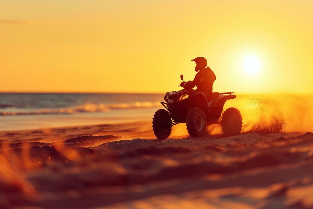 Racing quad bike on the sand outdoors horizon vehicle.