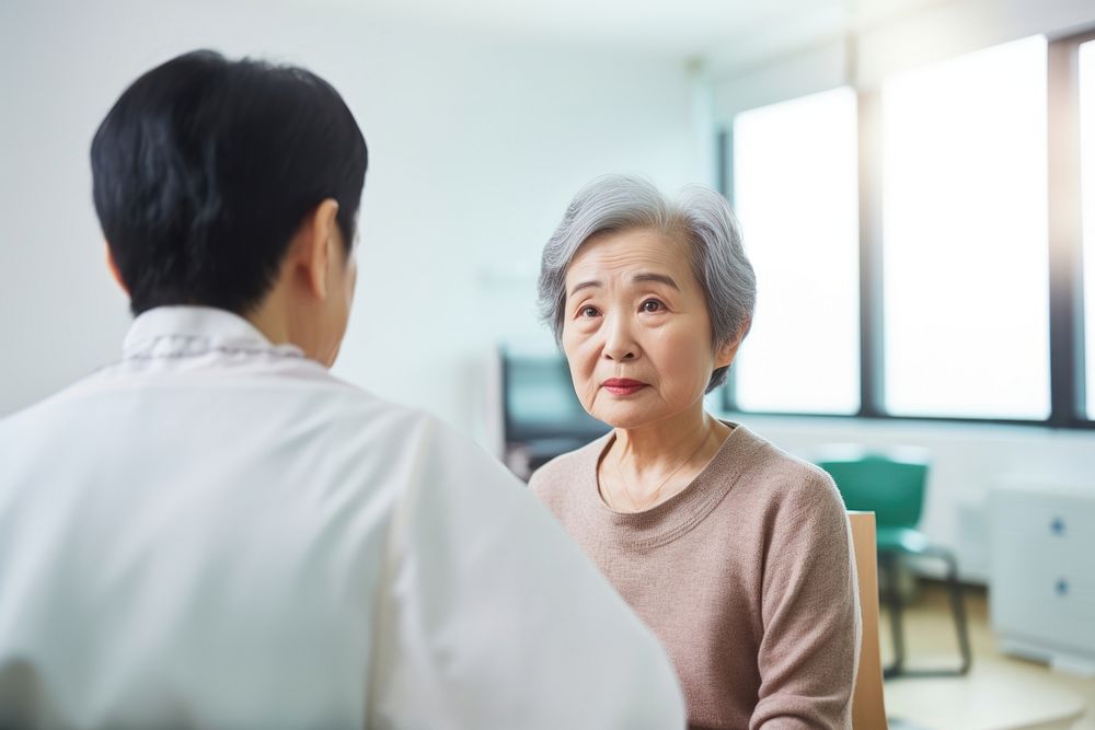 Endocrinology Doctor Examining Senior Japanese Woman doctor adult woman.