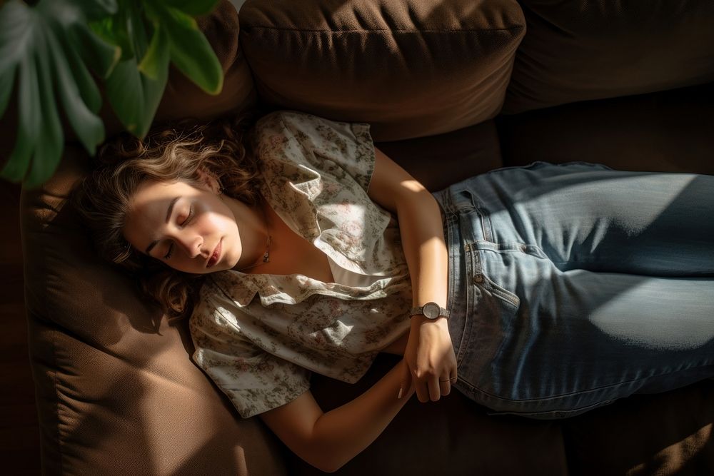 Latino woman with smartphone furniture sleeping sofa.