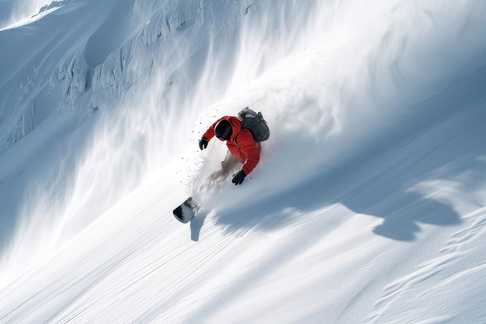 Snowboarder slides down on the snowy mountain side snowboarding recreation adventure.