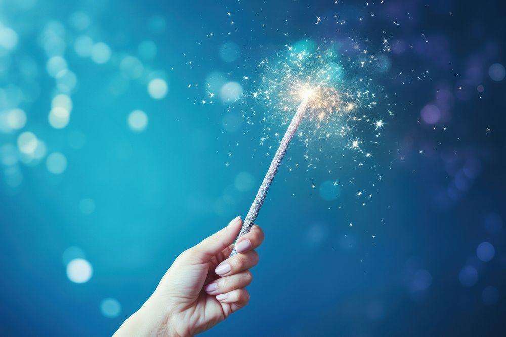 Magic wand with sparkle fireworks holding sparks.
