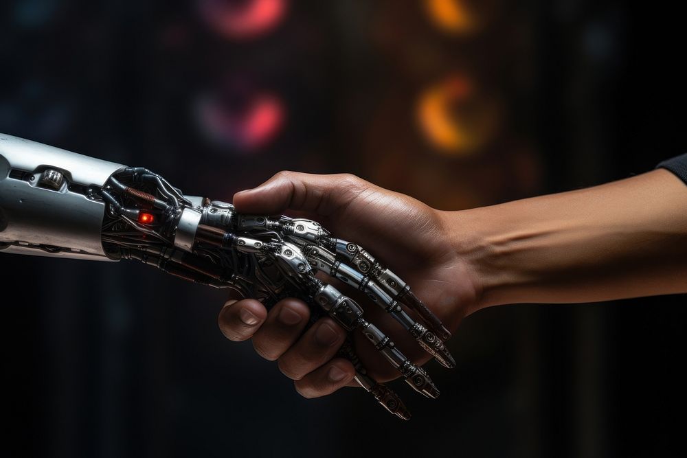 Human and robot check hand together technology electronics hardware.