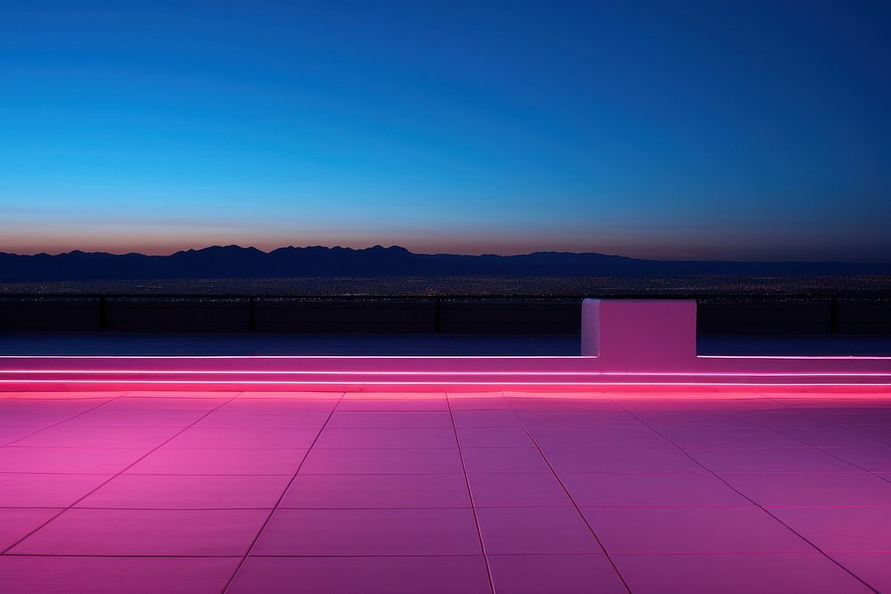 Neon rooftop light outdoors horizon.