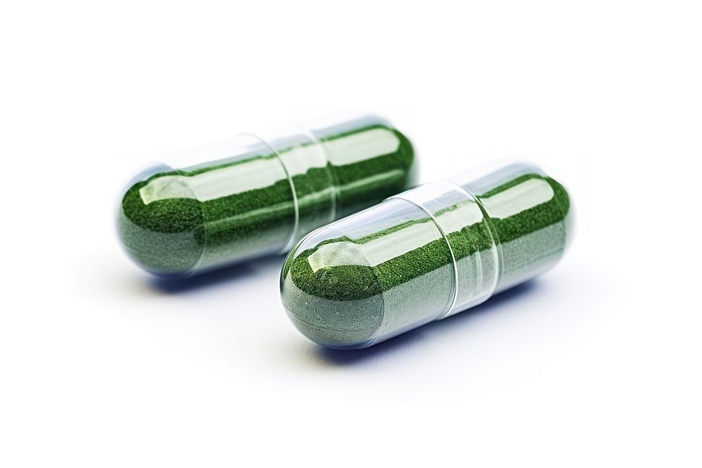 Herb powder capsules pill white background medication.