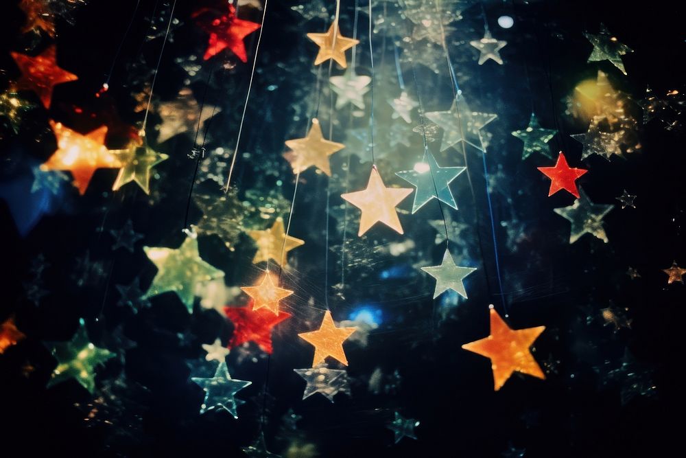 Stars flying around in a dark backgrounds night illuminated.