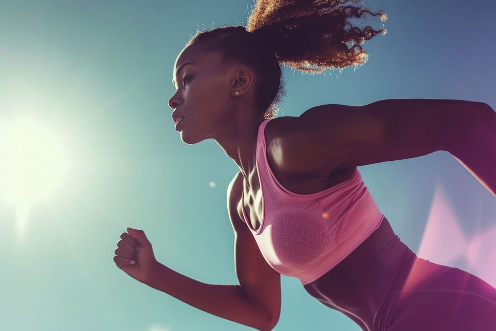 Black female athlete is running jogging adult determination.