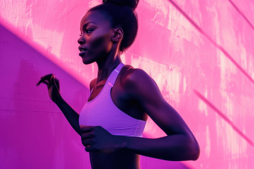 Black female athlete is running purple adult exercising.