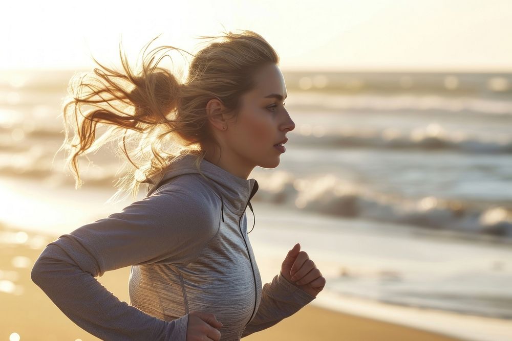 Healthy woman running beach outdoors.