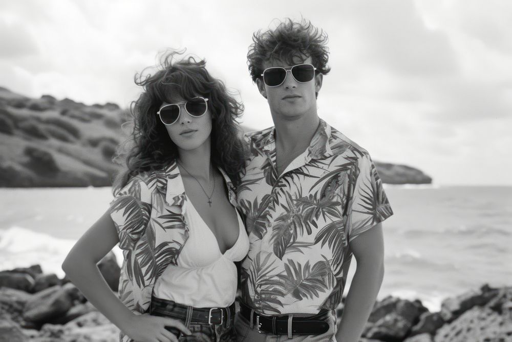 Male and female beach sunglasses portrait.