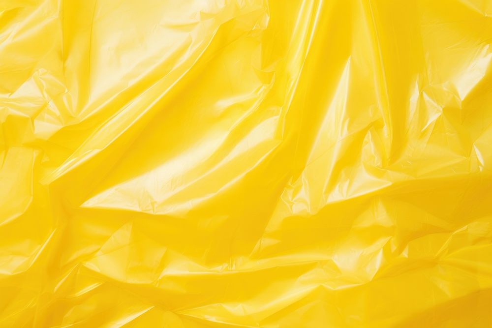 Cellophane texture yellow backgrounds crumpled.