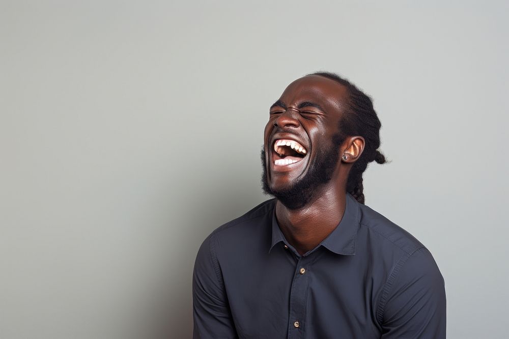 Black man laughing adult happiness hairstyle.