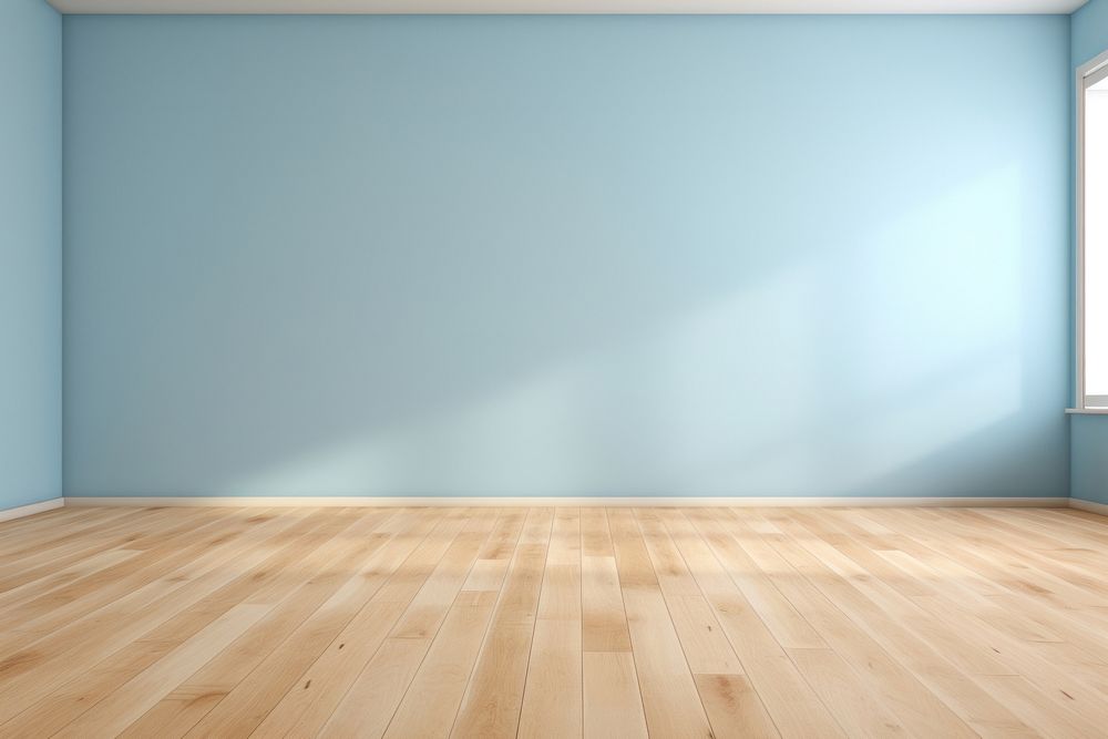 Light blue wall in an empty room with a wooden floor flooring architecture tranquility.