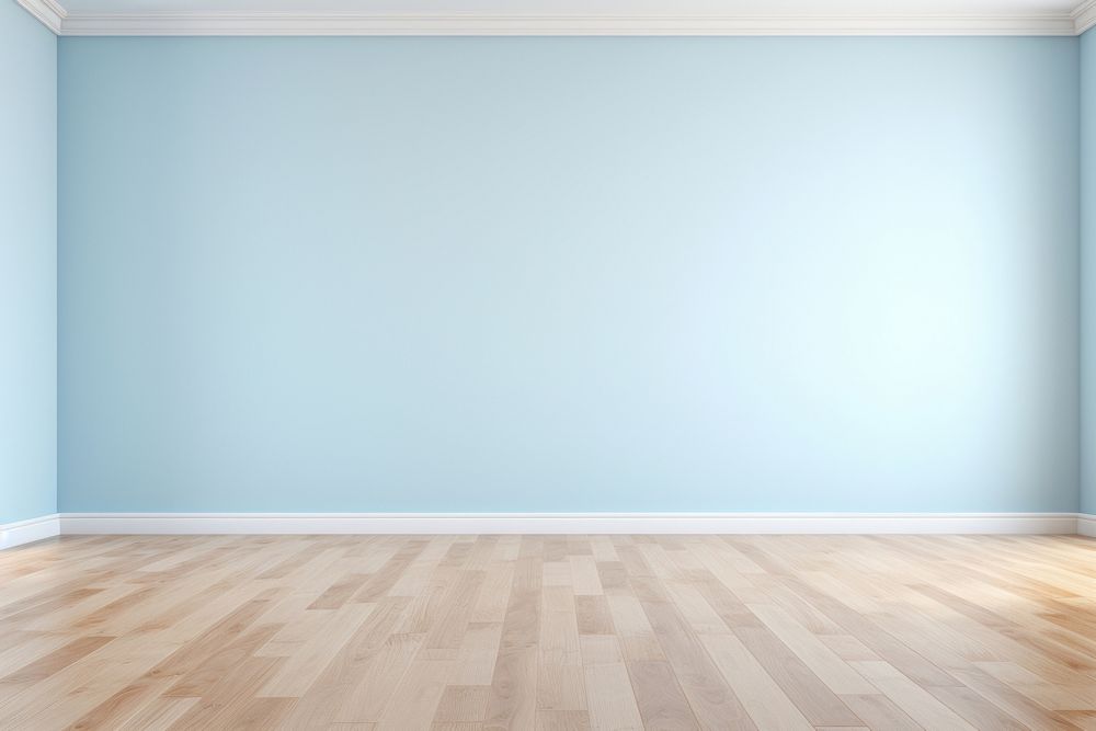 Light blue wall in an empty room with a wooden floor architecture flooring building.