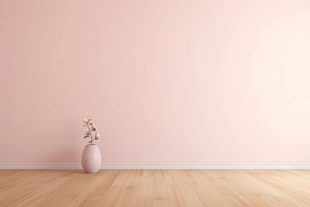 Light pink wall in an empty room with a wooden floor architecture flooring flower.